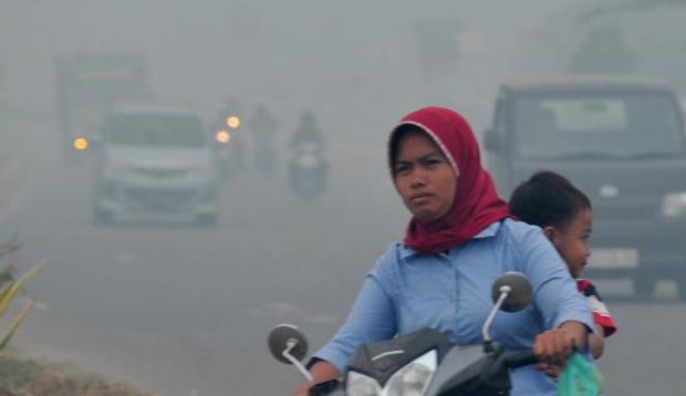Meski Daftar Korban Asap Riau Bertambah Panjang, Masih Banyak Juga yang Nekat keluar Rumah tanpa Masker