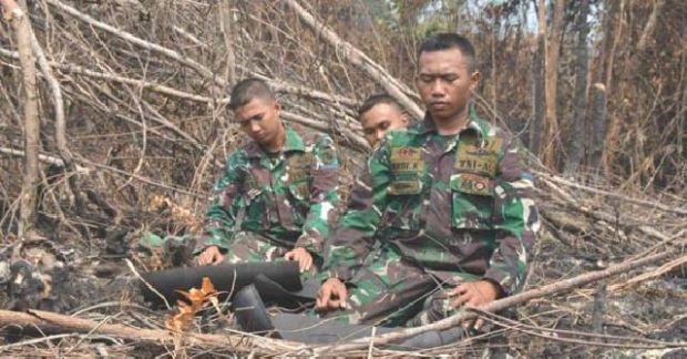 Bekerja dalam Diam, Kisah Heroik Prajurit TNI Pemadam Api di Riau: Bergulat dengan Panasnya Gambut, Setiap Hari Bertemu Ular Kobra dan Menahan Rindu pada Keluarga